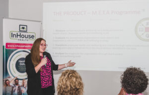 founder in-house health, Emma-Louise Fusari speaking at event