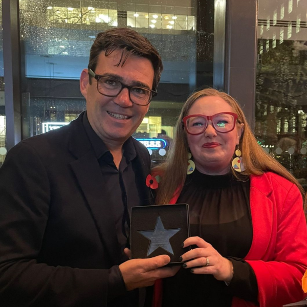 Emma with Andy Burnham and her Tech for Good Award